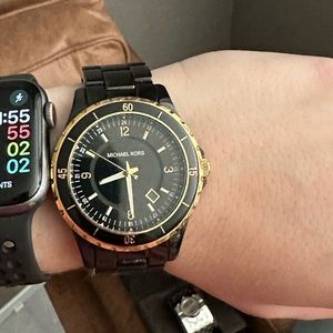 Michael Kors women’s Black and Gold watch